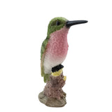 Colorful hummingbird figurine on a white background