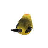 Colorful bird figurine with yellow body, red head, and black wings on a white background