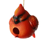 Red cardinal-shaped birdhouse on a white background