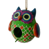 Colorful owl-shaped birdhouse on a white background